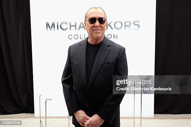 Designer Michael Kors poses backstage at the Michael Kors Fall 2016 Runway Show during New York Fashion Week: The Shows at Spring Studios on February...