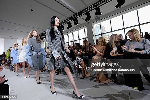 Naomie Harris, Riley Keough, Blake Lively, and Elaine Lively watch as models walk the runway during the Michael Kors Fall 2016 Runway Show during New...
