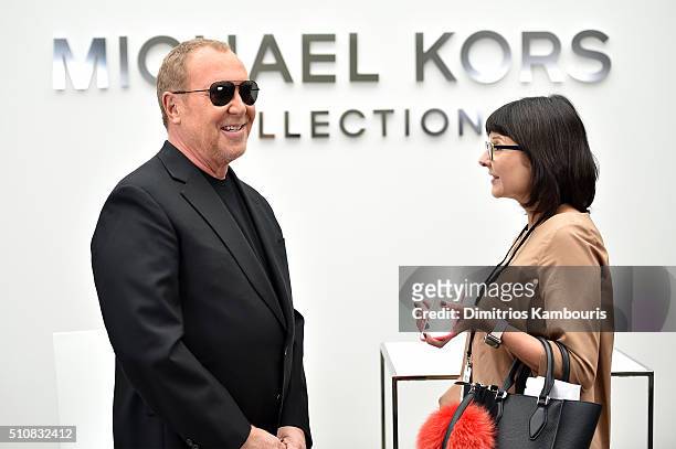 Designer Michael Kors prepares backstage at the Michael Kors Fall 2016 Runway Show during New York Fashion Week: The Shows at Spring Studios on...