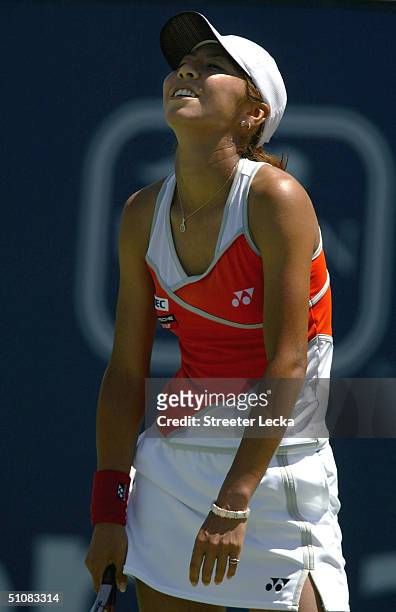 Shinobu Asagoe of Japan reacts to missing a return during the JP Morgan Chase Open on July 19, 2004 at the Home Depot Center in Los Angeles,...