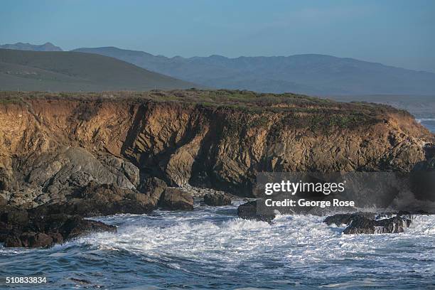 Heavy surf created by a large storm in the Gulf of Alaska sends huge waves crashing along the coastal rocks and shoreline on February 4 near the...