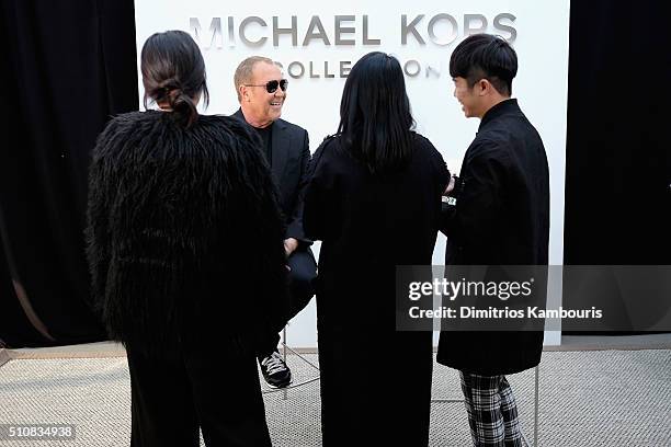 Designer Michael Kors prepares backstage at the Michael Kors Fall 2016 Runway Show during New York Fashion Week: The Shows at Spring Studios on...