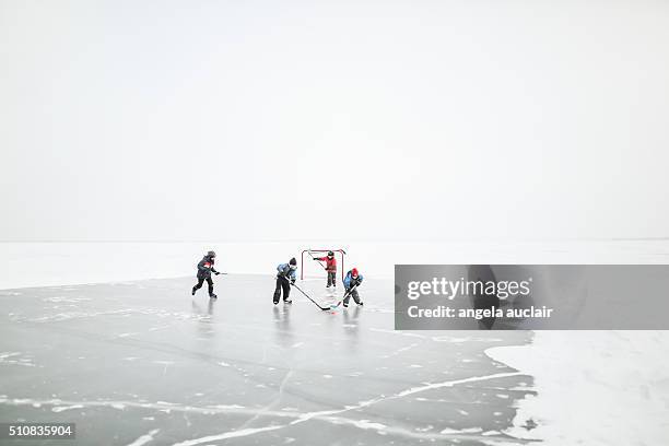 skating on a lake in canada - outdoor ice hockey stock pictures, royalty-free photos & images