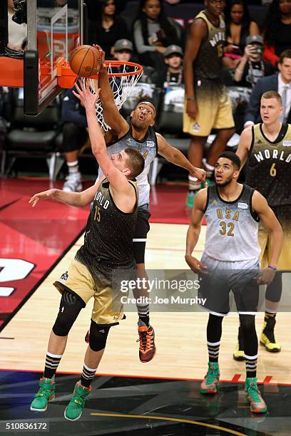 Jabari Parker of the USA Team blocks Nikola Jokic of the World Team during the BBVA Compass Rising Stars Challenge as part of the 2016 NBA All Star...