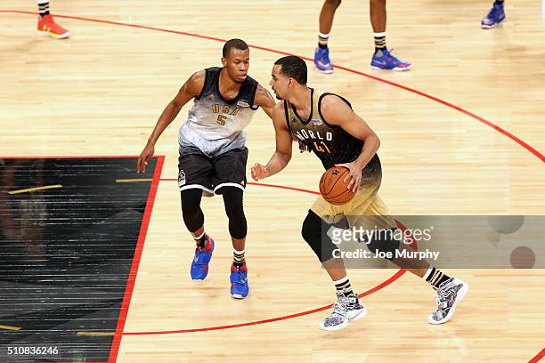 Trey Lyles of the World Team handles the ball against Rodney Hood of the USA Team during the BBVA Compass Rising Stars Challenge as part of the 2016...