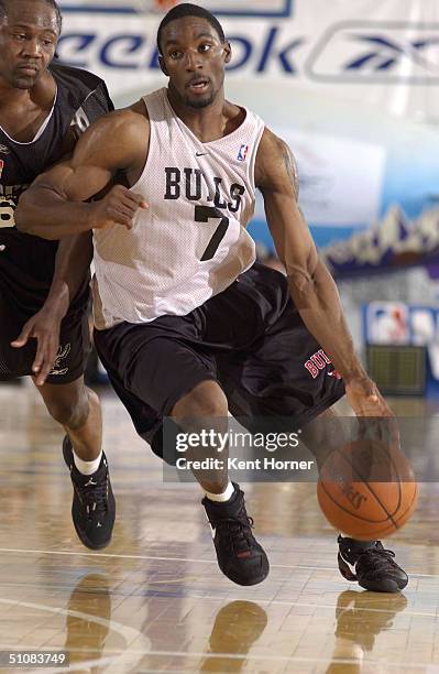 Ben Gordon of the Chicago Bulls dribbles against the San Antonio Spurs July 19, 2004 during the Reebok Rocky Mountain Revue at Salt Lake Community...