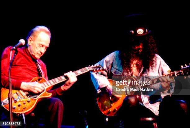Guitarists Les Paul and Slash perform together onstage at the House of Blues, Chicago, Illinois, December 2, 1996.