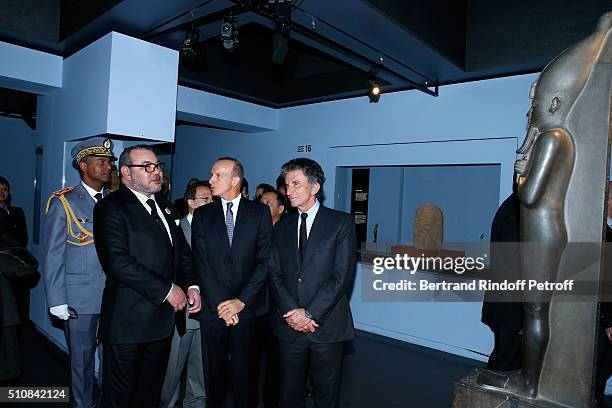 King Mohammed VI of Morocco, Curator of the exhibition Franck Goddio and President of the 'Institut du Monde Arabe' Jack Lang visit the 'Osiris,...