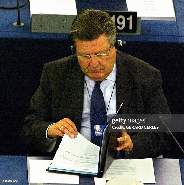 Belgian European deputy Antoine Dusquesne reads his notes 20 July 2004 at the European Parliament in Strasbourg. Spanish Socialist Josep Borrell was...