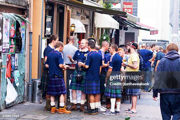 group of scotsmen in kilts - kilt stock pictures, royalty-free photos & images