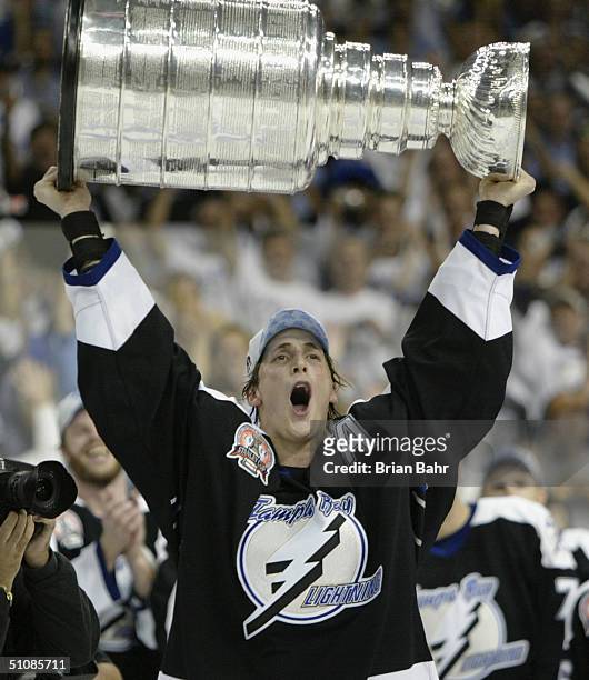 Vincent Lecavalier of the Tampa Bay Lightning holds the Stanley Cup above his head after the victory over the Calgary Flames in Game seven of the NHL...