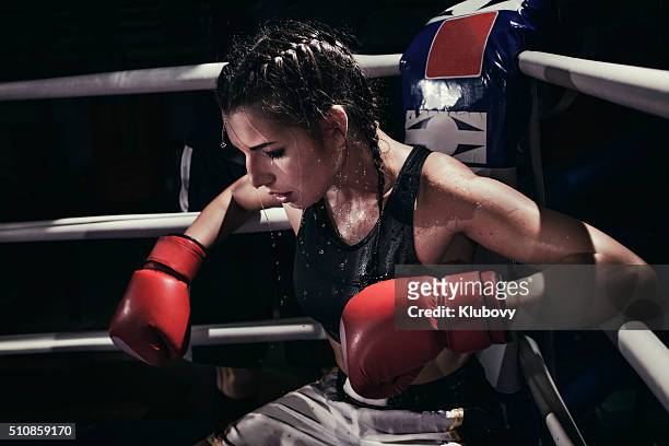 female boxer in a boxing ring - female boxer stock pictures, royalty-free photos & images