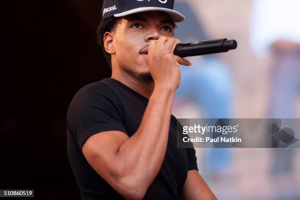 American musician Chance the Rapper performs onstage at the Pritzker Pavilion in Millennium Park, Chicago, Illinois, August 27, 2014.