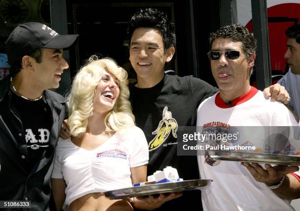 Kal Penn, John Cho and Gary "Baba Booey" Dell'Abate of the Howard Stern show promote the new movie "Harold & Kumar Go to White Castle" with White...