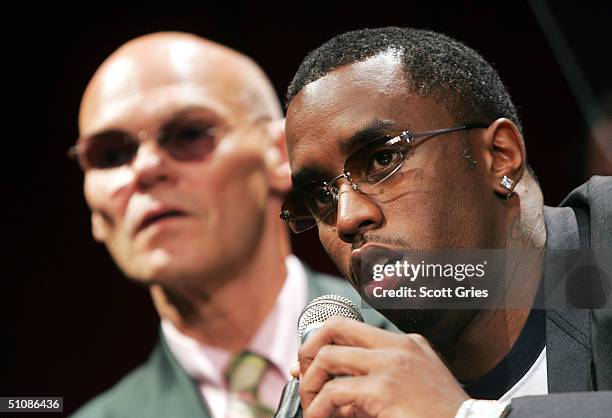 Rapper/actor Sean "P. Diddy" Combs gestures as he speaks while political consultant James Carville listens during a press conference to announce...