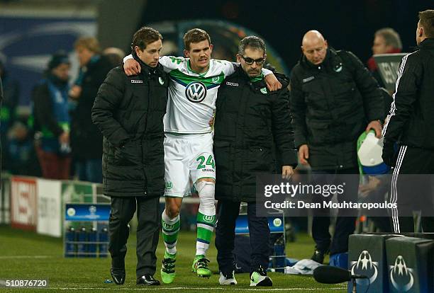 Sebastian Jung of Wolfsburg leaves the pitch due to injury during the UEFA Champions League round of 16, first leg match between KAA Gent and VfL...