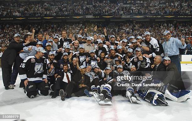 Tampa Bay Lightning players and staff pose for a team photo with the Stanley Cup after defeating the Calgary Flames in Game seven of the NHL Stanley...