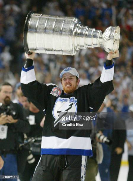 Brad Richards of the Tampa Bay Lightning holds the Stanley Cup above his head after the victory over the Calgary Flames in Game seven of the NHL...