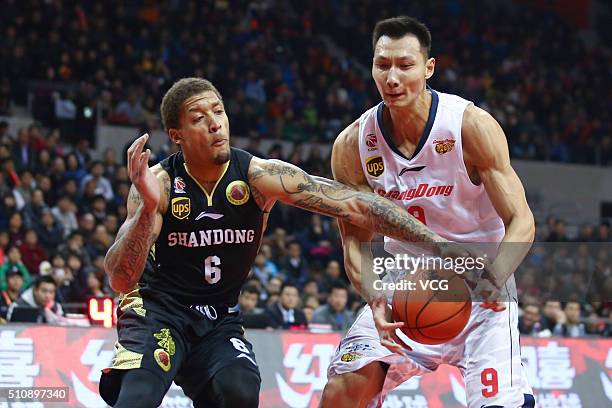 Michael Beasley of Shandong Golden Stars defends against Yi Jianlian of Guangdong Southern Tigers during the Chinese Basketball Association 15/16...