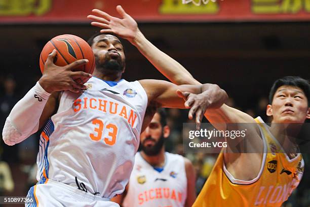 Mike Harris of Sichuan Blue Whales drives the ball against Hu Jinqiu of Zhejiang Lions during the Chinese Basketball Association 15/16 season...