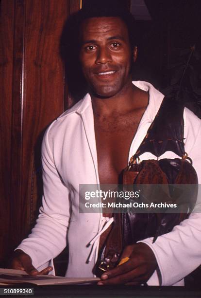 Actor Fred Williamson carrying his signature saddle bag at a post-production event in circa 1975.