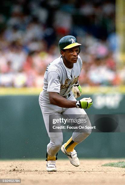 Outfielder Rickey Henderson of the Oakland Athletics runs the bases against the Chicago White Sox during an Major League Baseball game circa 1990 at...