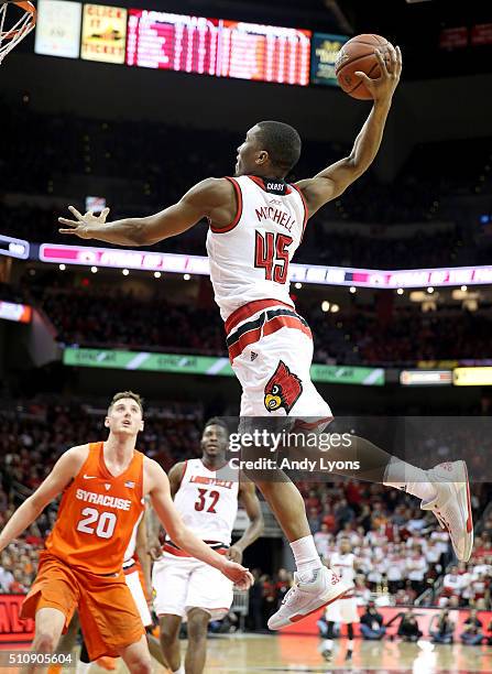 Donovan Mitchell of the Louisville Cardinals dunks the ball during the game against the Syracuse Orange at KFC YUM! Center on February 17, 2016 in...