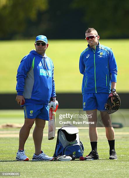 Australian coach Darren Lehmann speaks with Peter Siddle of Australia during an Australia nets session at Hagley Oval on February 18, 2016 in...