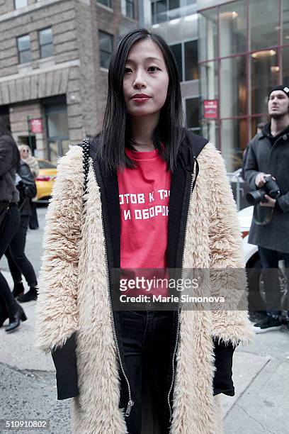 Fashion blogger seen during New York Fashion Week, wearing beige furs and red T-shirt by Gosha Rubchinsky at Women's Fall/Winter 2016 on February 17,...