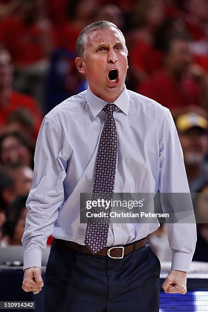 Head coach Bobby Hurley of the Arizona State Sun Devils reacts during the first half of the college basketball game against the Arizona Wildcats at...