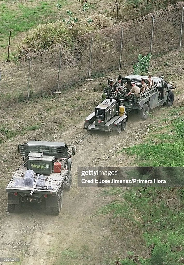 U S Navy Personnel In Charge Of Repairing Perimeter Fences At Camp Gar