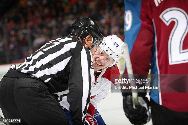 Jacob De La Rose of the Montreal Canadiens talks with Linesman Jay Sharrers during a break in the action against the Colorado Avalanche at the Pepsi...
