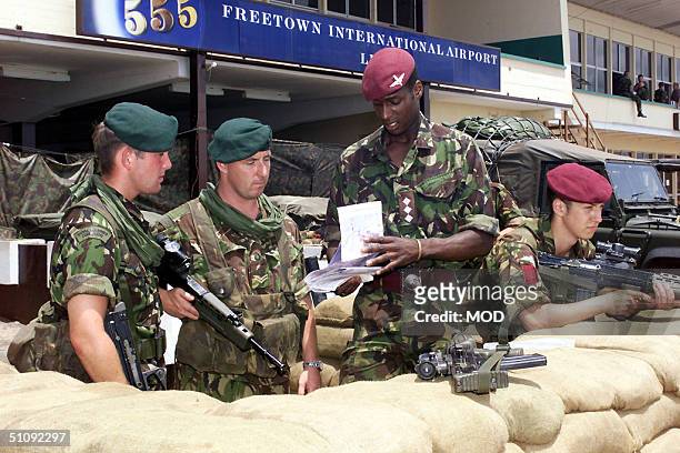 British Royal Marine Commandos From The Amphibious Ready Group Are Briefed May 24, 2000 After Arriving In Freetown, Sierra Leone. Recently, Two...