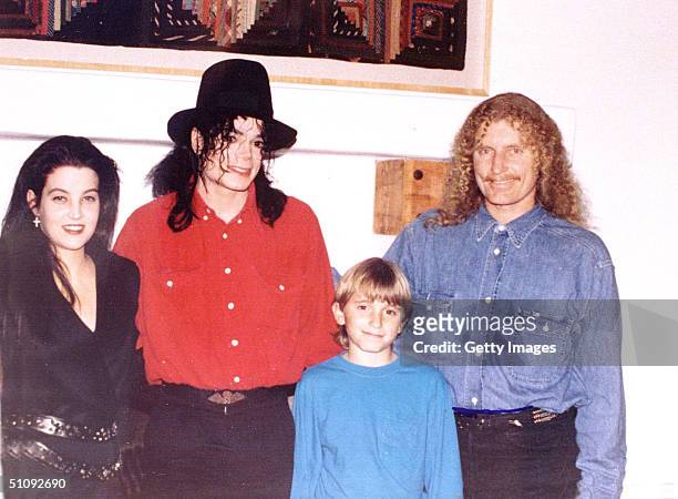 File Photo: Australian Artist Brett Livingston Strong, Right, Poses With His Son, Pop Star Michael Jackson, And Lisa Marie Presley, Left, August...