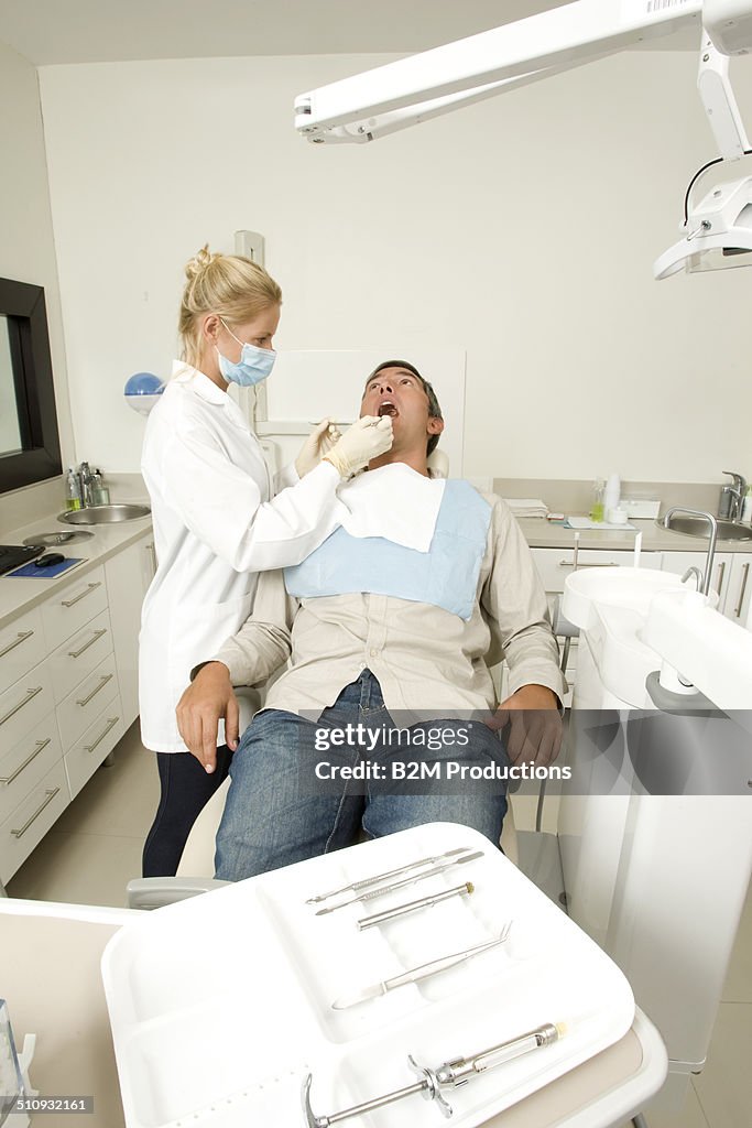 Dentist in examination room