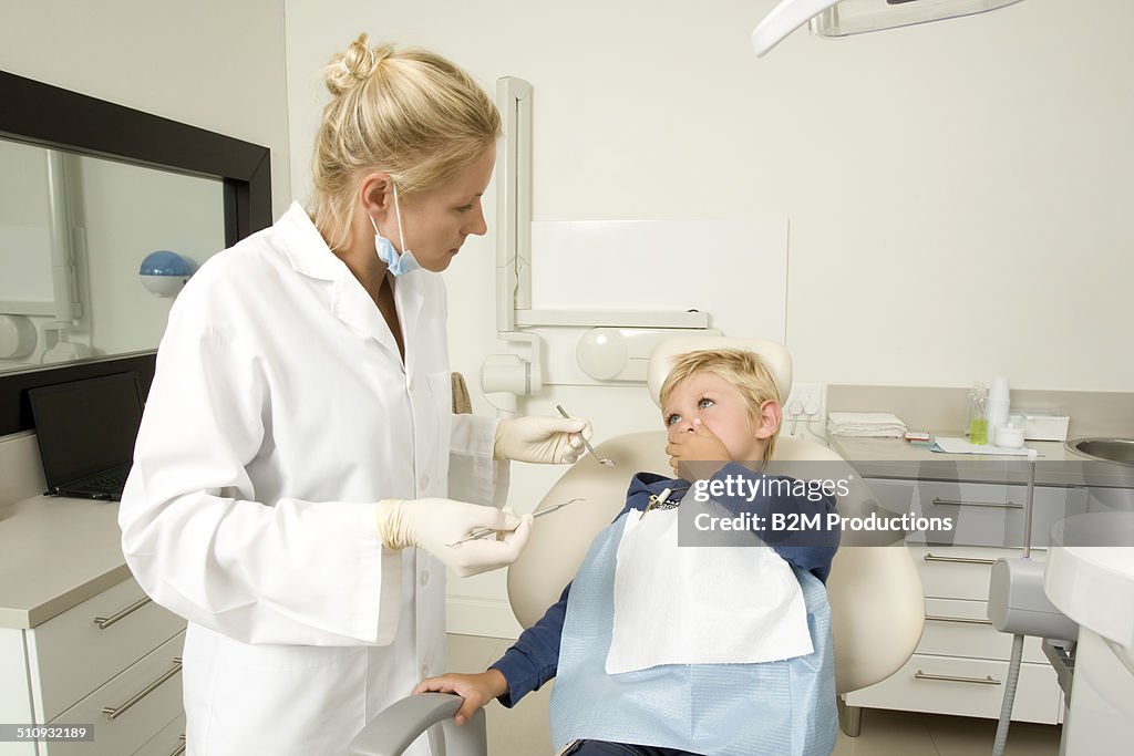 Dentist in examination room