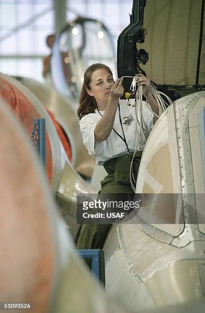 Shauna Sullins Installs A Wire Harness In An A-10 Thunderbolt Ii Fighter Jet At The Ogden Air Logistics Center, Hill Air Force Base, Utah. Sullins...