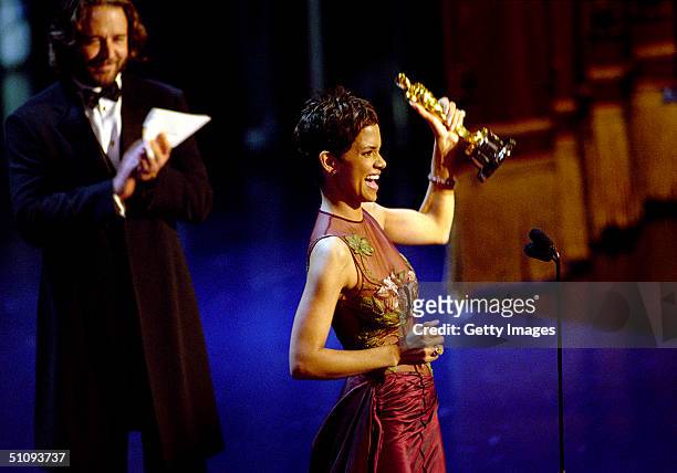 American actress Halle Berry accepts the Academy Award for Best Actress for her performance in "Monster's Ball", at the 74th Annual Academy Awards,...