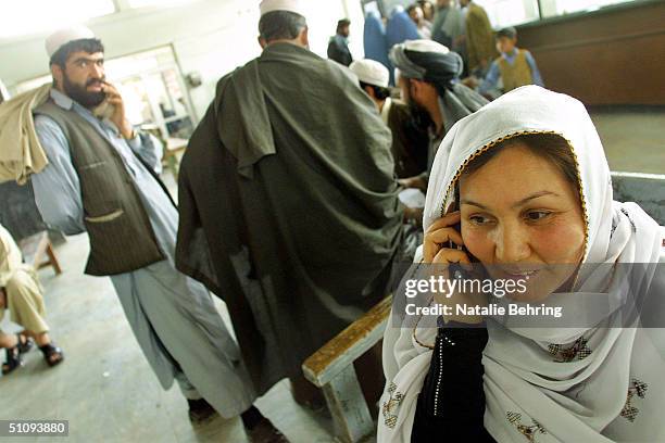 An Afghan Woman Makes Her First Call On A Mobile Phone April 23, 2002 In Kabul, Afghanistan. An Afghan-U.S. Telecommunication Joint Venture Has Set...