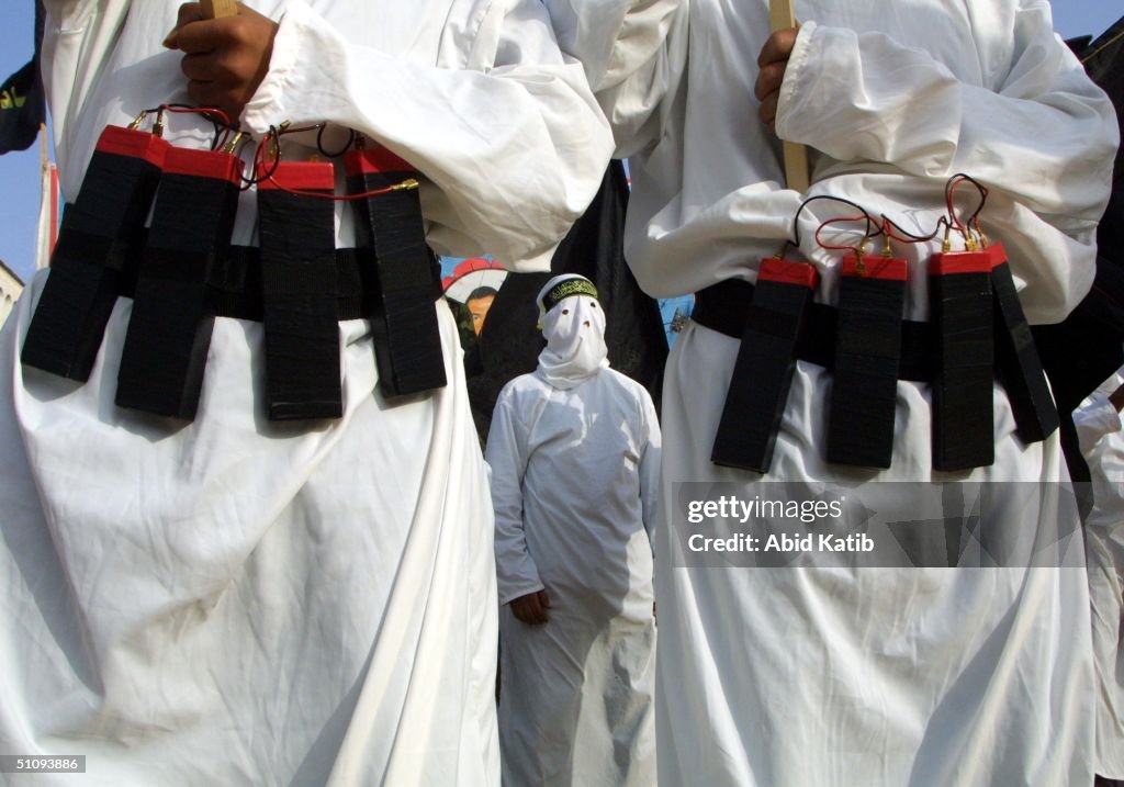 Masked Islamic Jihad Militants Wear Explosive Belts During A Rally Commemorating Mohammed...