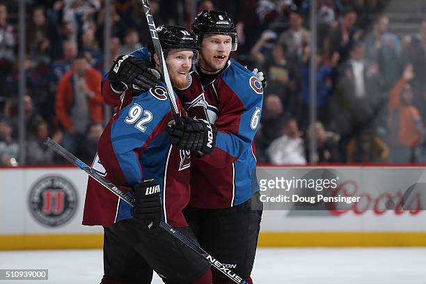 Erik Johnson of the Colorado Avalanche celebrates his short handed goal against the Montreal Canadiens with Gabriel Landeskog of the Colorado...
