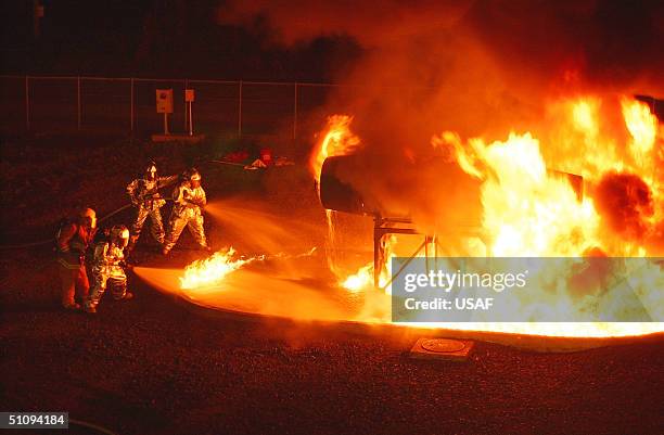 Firefighters Participate In A Training Exercise At Misawa Air Base In Japan In This Undated Photo. The P-19 Is A Firefighting Vehicle That Can...