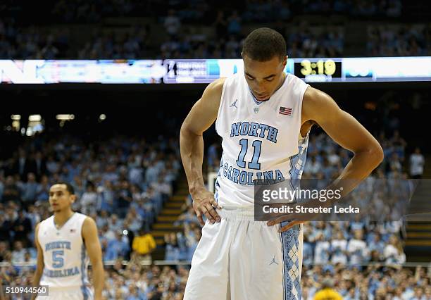 Teammates Marcus Paige and Brice Johnson of the North Carolina Tar Heels watch on during their game against the Duke Blue Devils at Dean Smith Center...