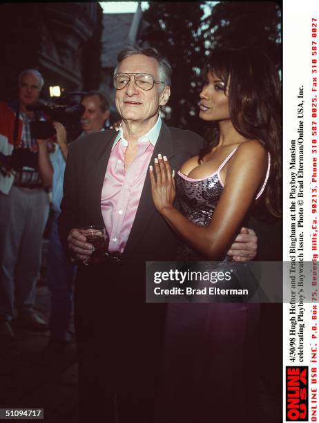 Hugh Hefner And Traci Bingham At The Playboy Mansion Celebrating Playboy's Baywatch Issue.