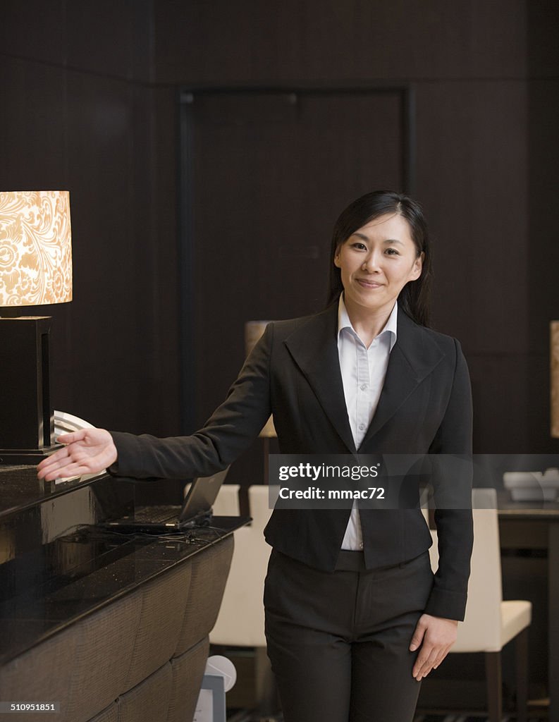 Portrait of Asian Concierge in Hotel