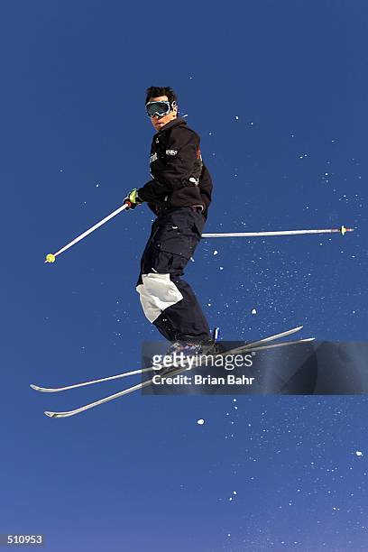 Jeremy Bloom twists off the first jump en route to a third place finish in the final round of mens'' moguls at the Sprint U.S. Freestyle Grand...