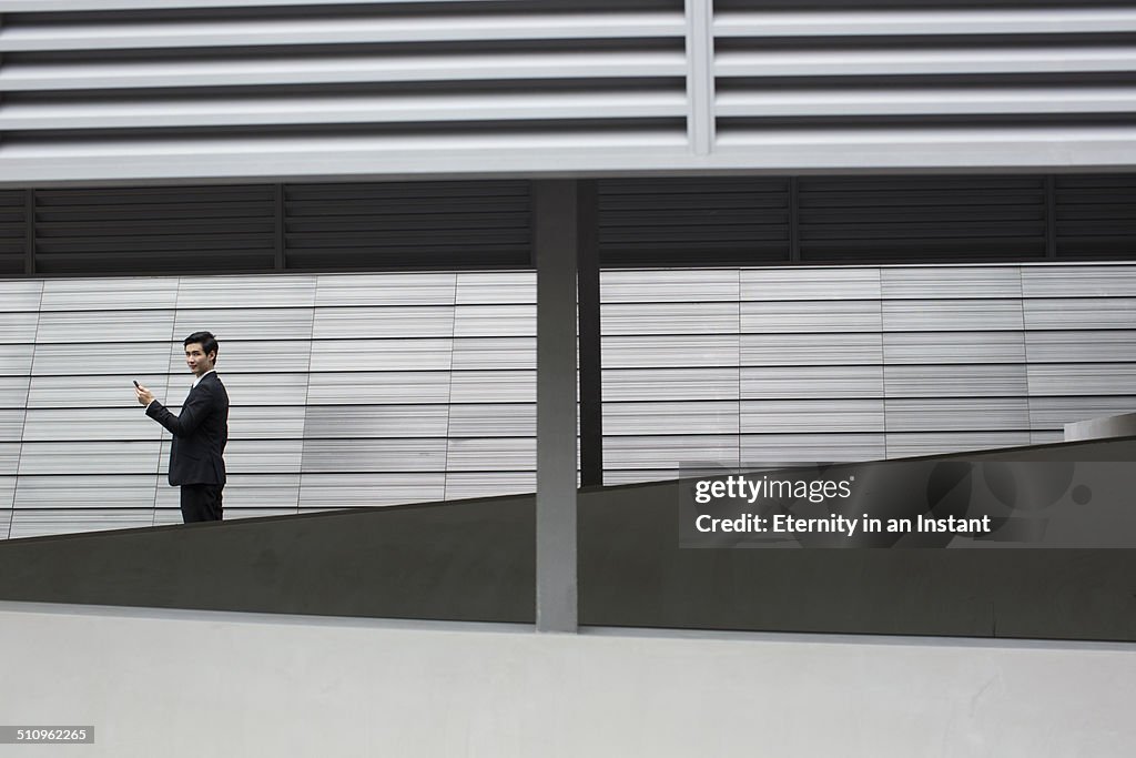 Businessman in front of a building.