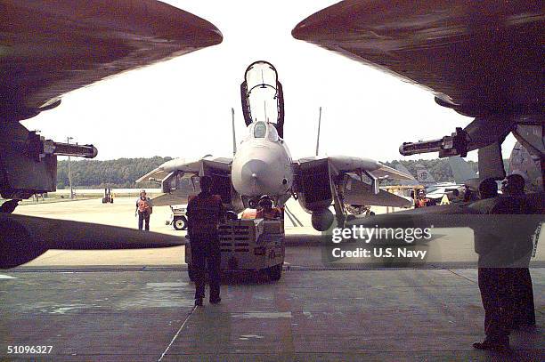Members Of Fighter Squadron 213 Squeeze Another F-14 "Tomcat" Into Hangar 500 At Naval Air Station Oceana In Preparation Of Hurricane Bonnie's.