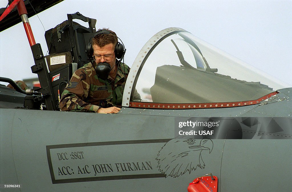 Staff Sgt Barry Mueller U S Air Force Monitors The Systems' Checks In The Cockpit Of A F 15E Eag