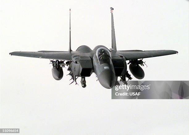 An F-1E Strike Eagle Flies Through The Clouds Over Eastern Turkey In Support Of Operation Northern Watch January 6, 1999. Earlier Four U.S. Air Force...
